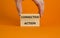 Corrective action symbol. Wooden blocks with words `Corrective action` on beautiful orange background. Businessman hand. Busines