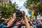 Correspondent takes photo during the Gay Pride parade