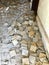 A corridor full of beat-up tiles during the reconstruction of the old apartment