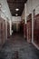 A corridor full of shops with old wooden doors with metal hinges inside Souq Waqif in Qatar 2