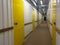 Corridor full of yellow doors in self storage building