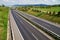 Corridor highway with the transition for animals, in the distance three red car