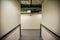 Corridor inside a building with blind corners and a convex safety mirror