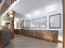 The corridor in a loft-style with wood paneling and paintings on