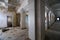 A corridor with marble columns and moldings on the ceiling. Abandoned mansion