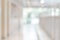 Corridor in school or office building blur background with blurry interior view empty hall way, glass curtain wall and floor