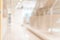 Corridor in school or office building blur background with blurry interior view empty hall way, glass curtain wall and floor