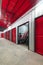 Corridor of self storage unit with red doors. Rental Storage Units