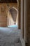 Corridor surrounding the courtyard of the public mosque of Ahmad Ibn Tulun framed by huge decorated arches, old Cairo, Egypt