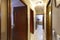 Corridors of a residential house with mahogany wood doors to access various rooms