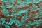 Corroded copper surface with verdigris
