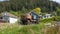 Corroded truck in village. Old abandoned truck covered in rust. Rusty truck outdoors