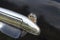 Corrosion focus on the car over door handle.