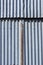 Corrugated iron texture with a rusted metal strip in the middle