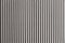 Corrugated white paper. Vertical contrast stripes, hard light, dark shadow. Horizontal background for banner, copy space. Abstract