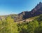 Corse View on refuge Ortu di Piobbu first part of GR 20 famous trek with green birch tree sharp mountain peak and blue sky