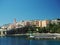 Corsica Bastia port view from sea on harbour with green lighthous church and old town blue sky