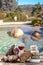 Corsican specialities appetizer: delicatessen, and cheese made in Corsica over a swimming pool panorama background, with