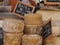 Corsican Tomme de brebis cheese on food stall in local market, Corsica