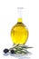 Corsican, traditional Olive oil glass bottle and olive branch on the table on a white vackground