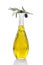 Corsican, traditional Olive oil glass bottle and olive branch on top on a white vackground