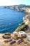 Corsican wild pork delicatessen, and cheese made in Corsica with the Porto veccio bay cliff panorama background