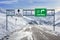 Cortina and San Vito si Cadore Italian ski town road big sign with a lot of snow and mountain sky