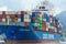 Cosco Piraeus shipping freighter loaded with containers on the Panama canal