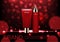 Cosmetic ads template, red bokeh and small glitter light with co