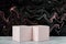 Cosmetic black abstract background with geometric shapes. Two cement cubic podiums. Mockup for the demonstration of