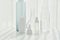 Cosmetic bottle containers and crystal clear glassware, Minimal skincare concept with light and shadow reflection effect