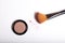 Cosmetic brush and blush powder isolated