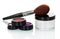 Cosmetic brush, shadows, lip gloss, blush and cream jar isolated