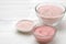 Cosmetic clay. Pink cosmetic clay in different types on a white wooden table. face mask and body. care products. spa