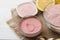 Cosmetic clay. Pink cosmetic clay in different types on a white wooden table. face mask and body. care products. spa