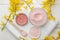 Cosmetic clay. Pink cosmetic clay in different types on a white wooden table. face mask and body. care products. spa. top view