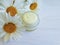 cosmetic cream camomile flower handmade treatment wooden background