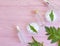 Cosmetic cream, leaf on wooden background