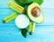 Cosmetic cream, oil, vitamin organic avocado health on a wooden background