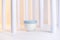 Cosmetic cream template with white architecture columns close-up