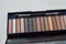 Cosmetic palette with brush and eye shadow with light brown, beige and Nude eyeshadow