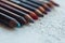 Cosmetic pencils for applying makeup on the face close-up. eye liner in macro on blurred background