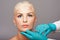 Cosmetic plastic surgeon injecting aesthetics face