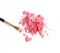 Cosmetic powder brush and crushed blush palette isolated on white