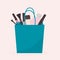 Cosmetic products and perfume in shopping bag. Concept of fashion and glamour. Purchases for beauty blogger or makeup artist.