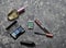 Cosmetic products for women& x27;s beauty layout on a concrete surface. Shadows, mascara, lipstick, perfume bottle. Top view