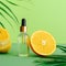 Cosmetic serum Vitamin C in glass bottle with pipette dropper. Orange essential oil with citrus ingredients Vitamin C palm leaves