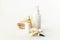 Cosmetic tonic and serum unbranded white bottles, towel and jasmine blossom. Spa concept