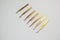 Cosmetic tweezers in gold color on a white background.tools for eyelash extensions and eyebrow design