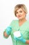 Cosmetician holding a jar of wax for depilation smiling on a white background. Natural product for hair removal. Copy